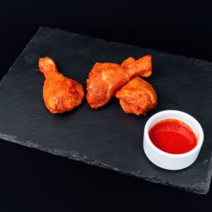 Juicy tandoori chicken drumsticks ready to cook